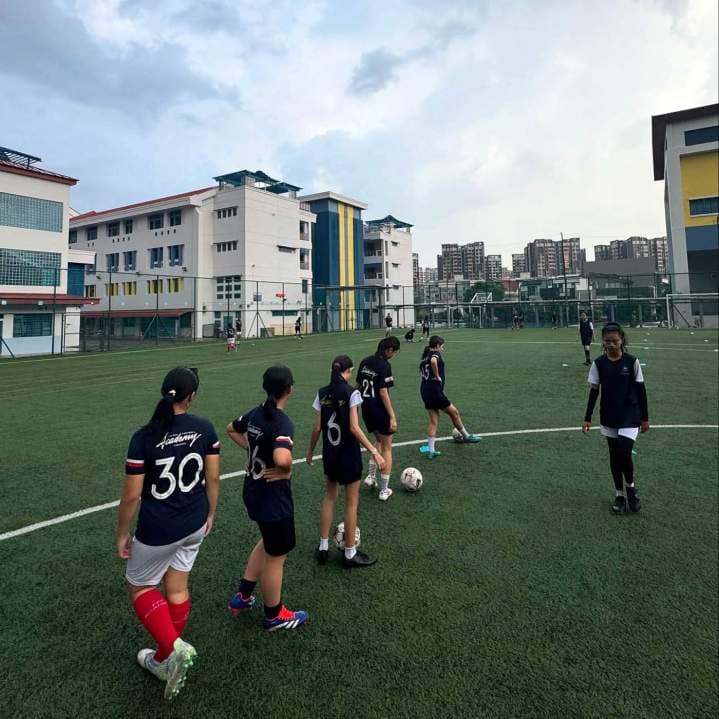 Young girls' football training in Melbourne